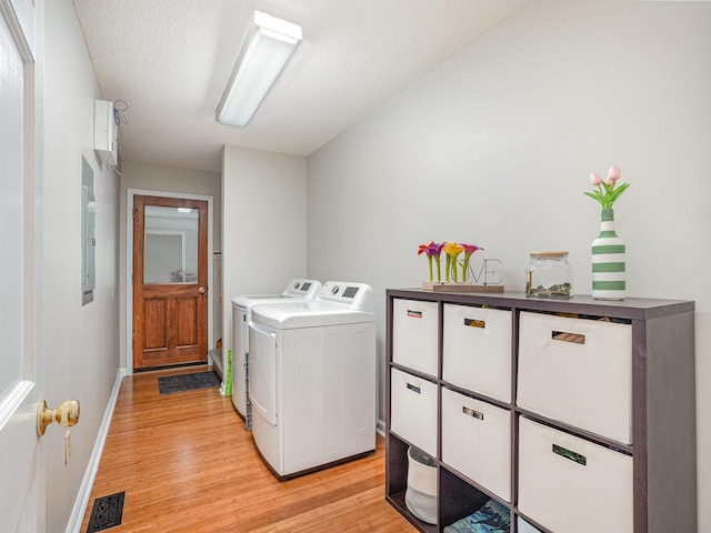 760 Three Wood, Woodruff, SC 29388 - washroom featuring light wood finished floors, independent washer and dryer, electric panel, and baseboards