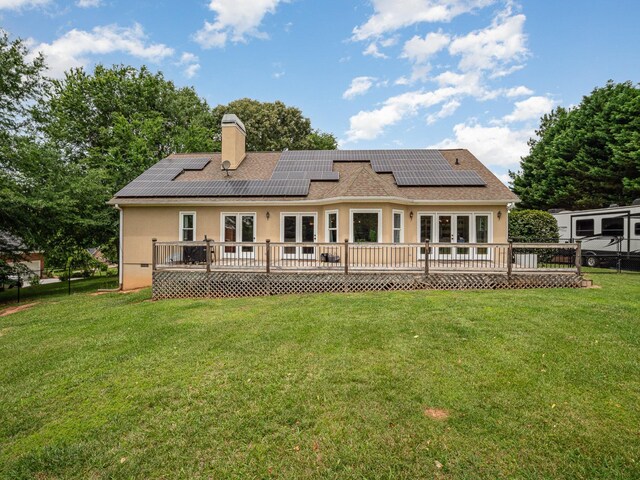 760 Three Wood, Woodruff, SC 29388 - rear view of house with french doors, a deck, a chimney, stucco siding, and solar panels