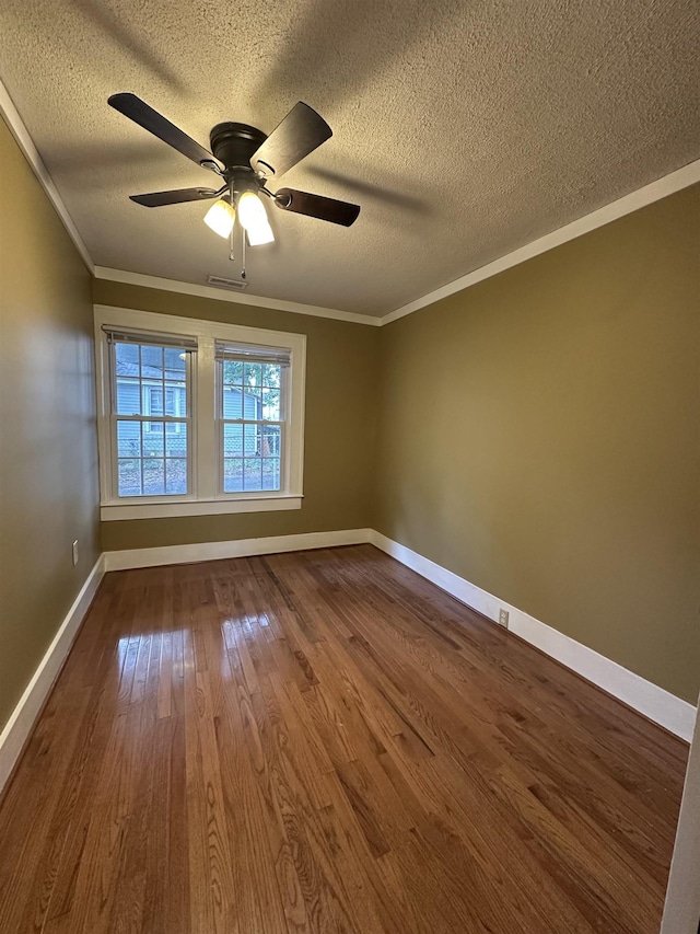 221 Mill, Gaffney, SC 29341 - unfurnished room with a textured ceiling, ornamental molding, ceiling fan, dark wood finished floors, and baseboards
