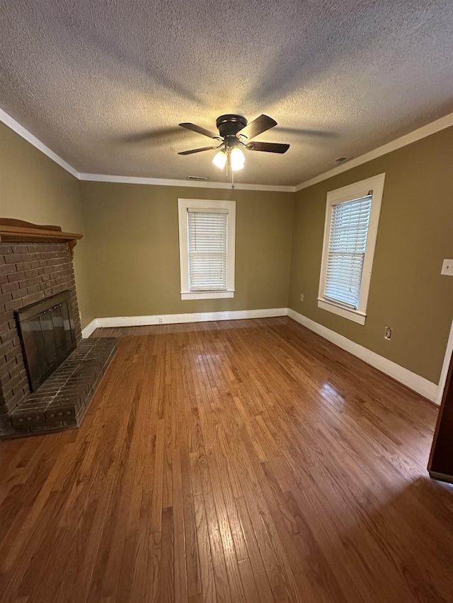 221 Mill, Gaffney, SC 29341 - unfurnished living room with crown molding, wood finished floors, healthy amount of natural light, ceiling fan, and a textured ceiling