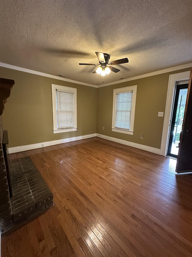 221 Mill, Gaffney, SC 29341 - unfurnished living room with hardwood / wood-style floors, baseboards, healthy amount of natural light, a ceiling fan, and a textured ceiling