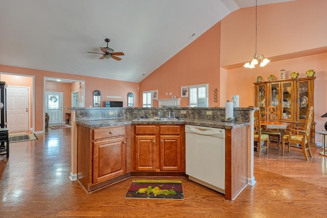 427 Listrac, Moore, SC 29369 - kitchen featuring white dishwasher, light wood-type flooring, a sink, high vaulted ceiling, and a chandelier