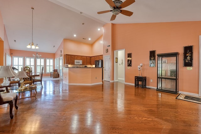 427 Listrac, Moore, SC 29369 - living room with a chandelier, high vaulted ceiling, ceiling fan, wood finished floors, and baseboards