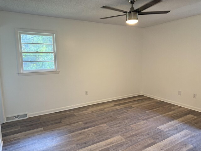 213 Loring, Spartanburg, SC 29302 - empty room with dark wood finished floors, ceiling fan, and baseboards