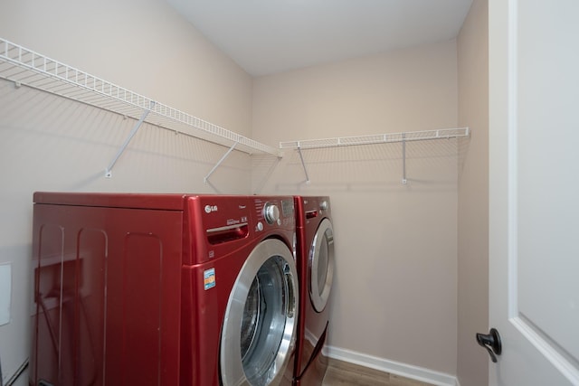 170 Old Timber, Woodruff, SC 29388 - laundry area with independent washer and dryer, baseboards, and wood finished floors