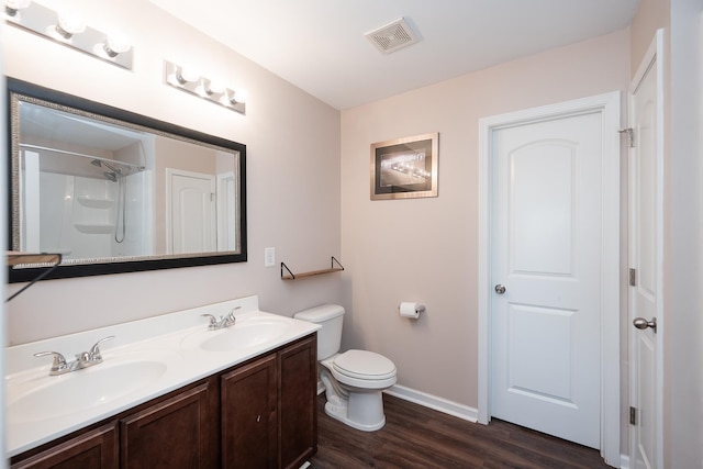 170 Old Timber, Woodruff, SC 29388 - full bathroom featuring wood finished floors, toilet, double vanity, baseboards, and a shower