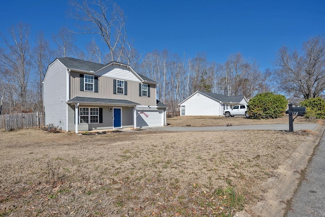 170 Old Timber, Woodruff, SC 29388 - traditional home with driveway, a garage, covered porch, and board and batten siding