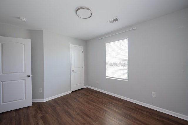 170 Old Timber, Woodruff, SC 29388 - unfurnished bedroom featuring dark wood-style flooring and baseboards