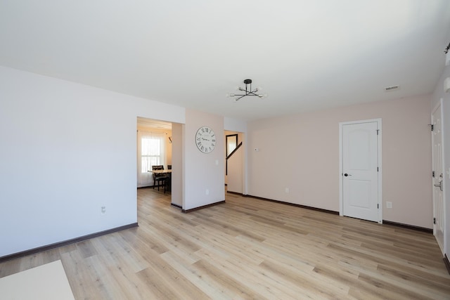 170 Old Timber, Woodruff, SC 29388 - spare room featuring light wood finished floors, a chandelier, and baseboards