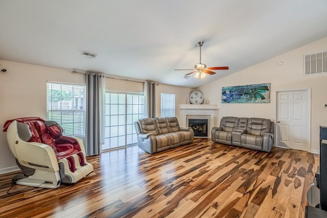 217 Legacy, Inman, SC 29349 - living room featuring a ceiling fan, wood finished floors, vaulted ceiling, a fireplace, and baseboards