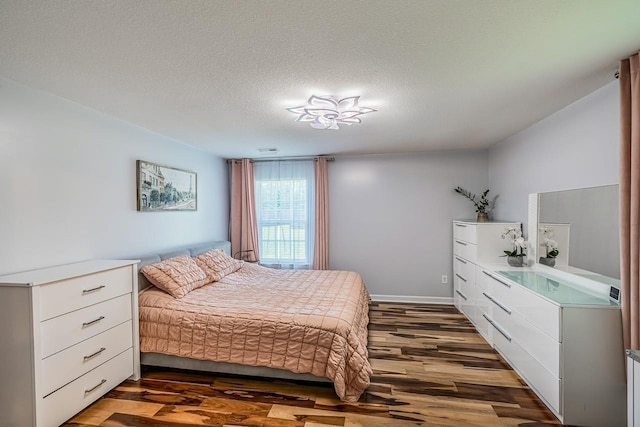 217 Legacy, Inman, SC 29349 - bedroom with dark wood-style flooring, a textured ceiling, and baseboards