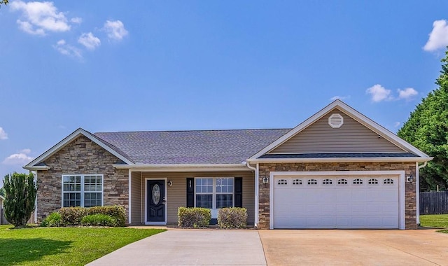 217 Legacy, Inman, SC 29349 - ranch-style house featuring stone siding, driveway, a front yard, and an attached garage