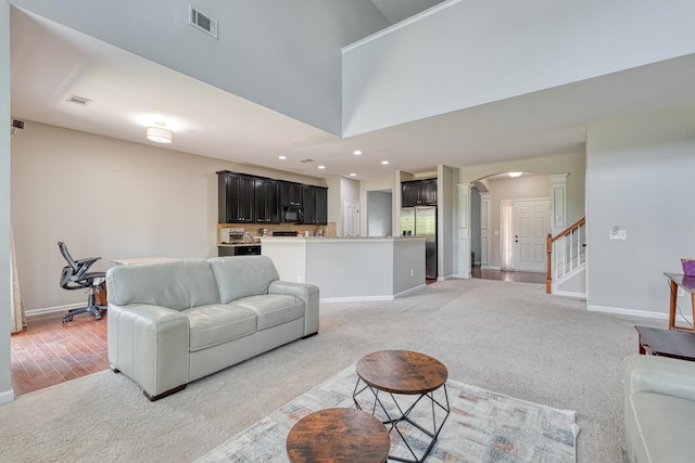 514 Millervale, Greer, SC 29650 - living room with ornate columns, arched walkways, baseboards, light colored carpet, and recessed lighting