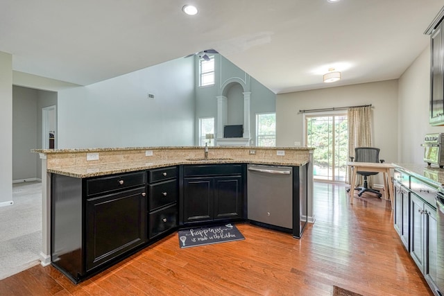 514 Millervale, Greer, SC 29650 - kitchen with stainless steel dishwasher, dark cabinetry, a sink, light wood-style floors, and lofted ceiling