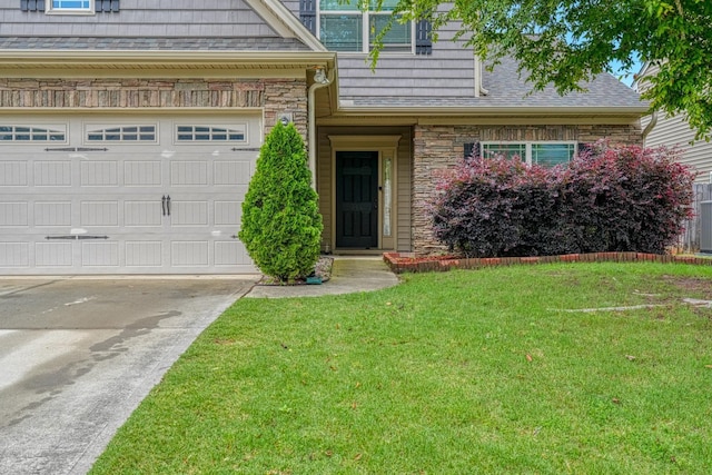 514 Millervale, Greer, SC 29650 - view of front of home featuring a front lawn, stone siding, driveway, and a garage