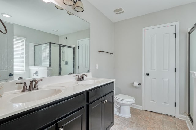 514 Millervale, Greer, SC 29650 - bathroom with a shower stall, double vanity, toilet, and baseboards