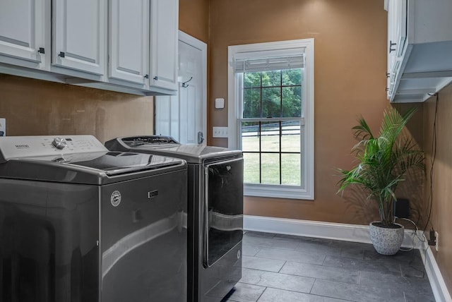 355 Night Lark, Campobello, SC 29322 - washroom featuring washing machine and dryer, cabinet space, baseboards, and plenty of natural light
