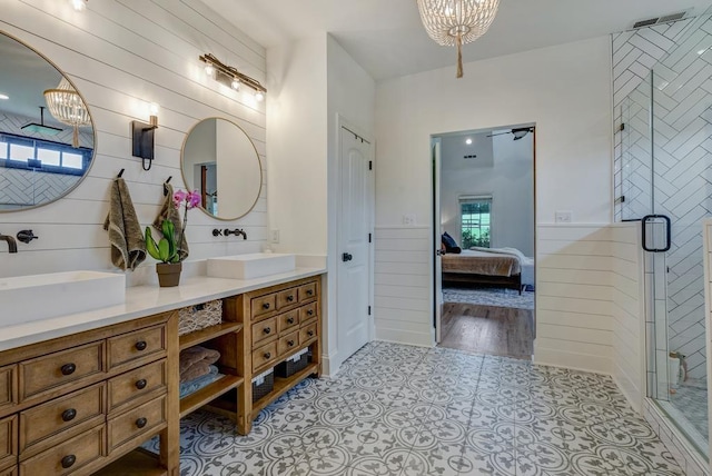 355 Night Lark, Campobello, SC 29322 - bathroom featuring double vanity, ensuite bath, a stall shower, wood walls, and a chandelier