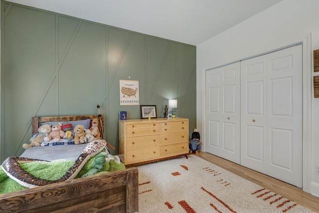 355 Night Lark, Campobello, SC 29322 - bedroom featuring wood finished floors, a decorative wall, and a closet