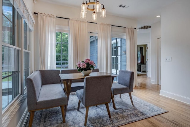 355 Night Lark, Campobello, SC 29322 - dining area featuring baseboards, wood finished floors, a chandelier, and recessed lighting