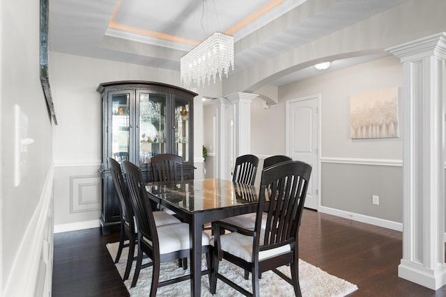 309 Old Kimbrell, Boiling Springs, SC 29316 - dining room with ornate columns, arched walkways, dark wood-style flooring, baseboards, and ornamental molding
