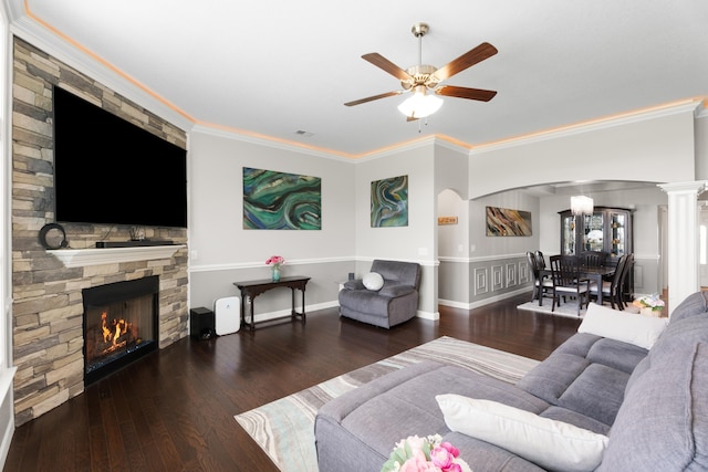 309 Old Kimbrell, Boiling Springs, SC 29316 - living room featuring arched walkways, wood finished floors, a ceiling fan, crown molding, and a stone fireplace