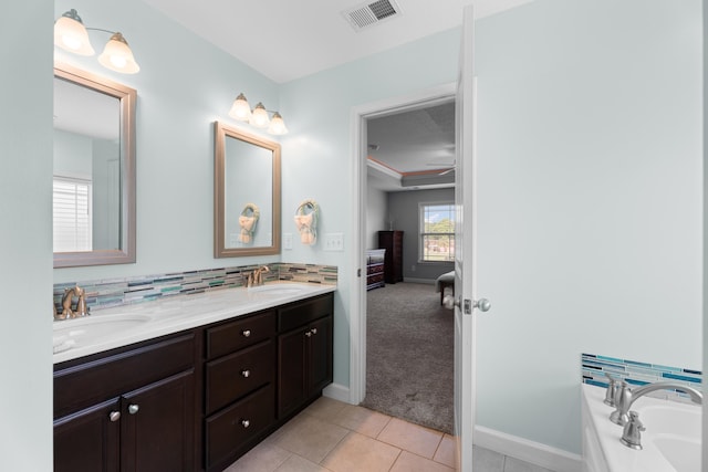 309 Old Kimbrell, Boiling Springs, SC 29316 - ensuite bathroom featuring double vanity, a garden tub, baseboards, and tile patterned floors