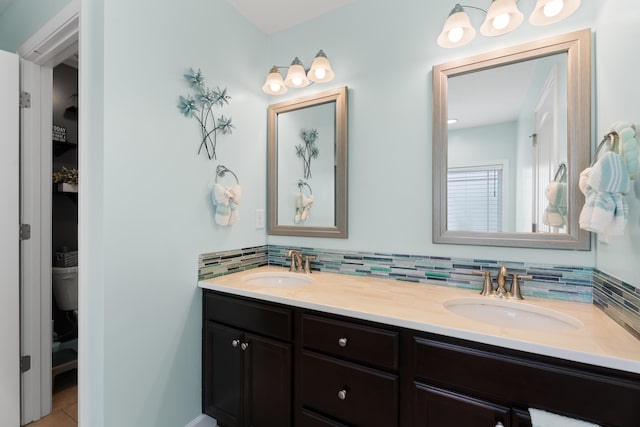309 Old Kimbrell, Boiling Springs, SC 29316 - full bath with double vanity, decorative backsplash, tile patterned floors, and toilet