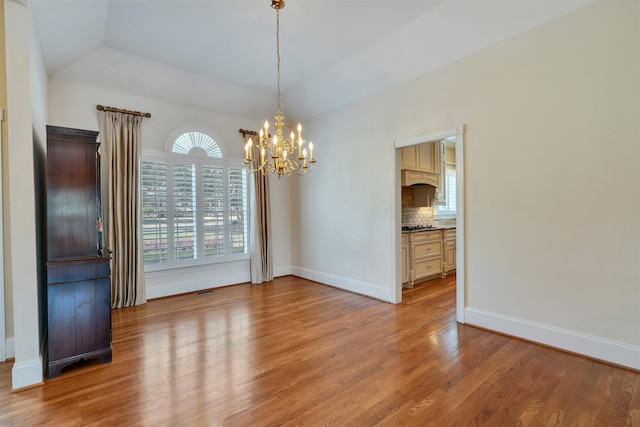 121 Commons, Spartanburg, SC 29302 - unfurnished room featuring a chandelier, vaulted ceiling, plenty of natural light, and light wood-style flooring