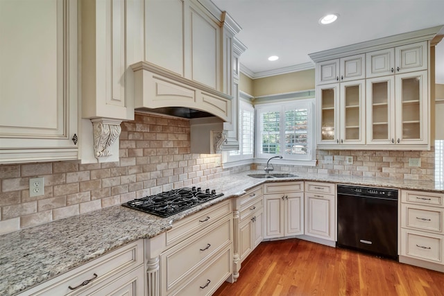 121 Commons, Spartanburg, SC 29302 - kitchen featuring black appliances, a sink, ornamental molding, light stone counters, and cream cabinets