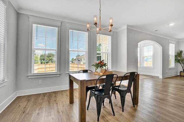 206 Hoss, Greenville, SC 29615 - dining room featuring crown molding, plenty of natural light, arched walkways, and a chandelier