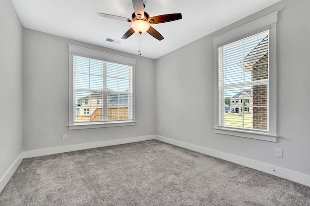 206 Hoss, Greenville, SC 29615 - carpeted spare room featuring healthy amount of natural light, baseboards, and a ceiling fan