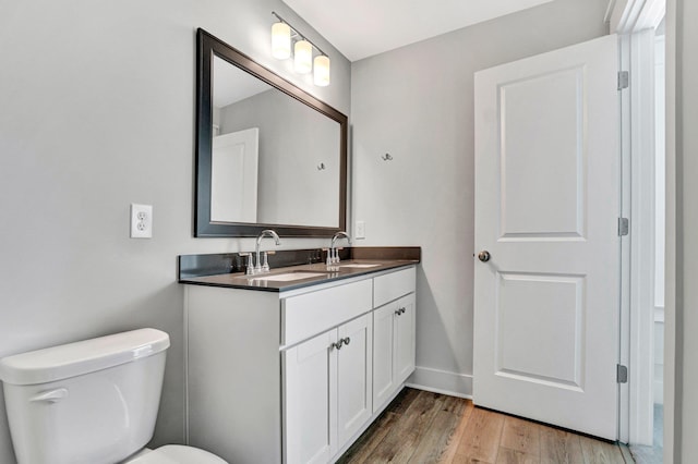 206 Hoss, Greenville, SC 29615 - bathroom featuring vanity, toilet, wood finished floors, and baseboards