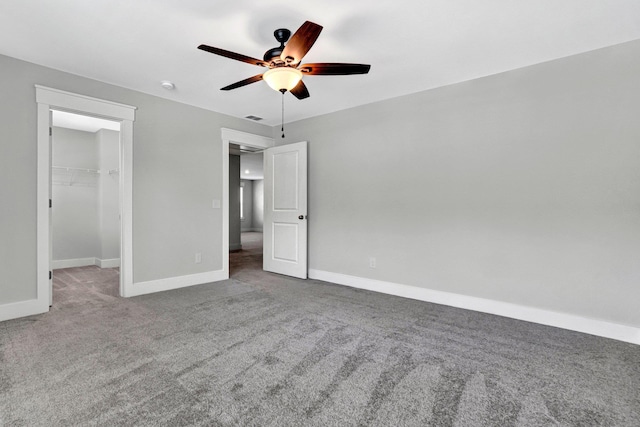 206 Hoss, Greenville, SC 29615 - unfurnished bedroom with carpet, a walk in closet, baseboards, and a ceiling fan