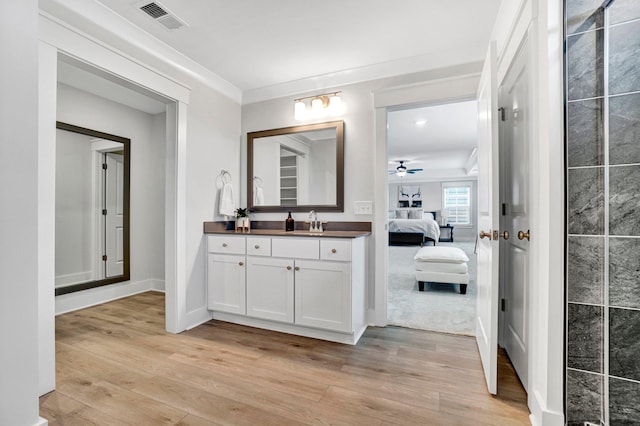 206 Hoss, Greenville, SC 29615 - ensuite bathroom with vanity, wood finished floors, a ceiling fan, ornamental molding, and baseboards