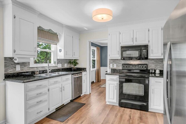 16 Chariot, Simpsonville, SC 29681 - kitchen with black appliances, a sink, white cabinetry, backsplash, and crown molding