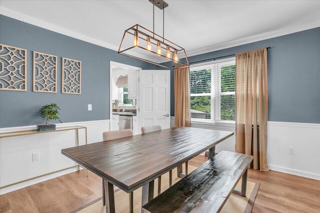 16 Chariot, Simpsonville, SC 29681 - dining space featuring healthy amount of natural light, light wood-style floors, ornamental molding, and a wainscoted wall