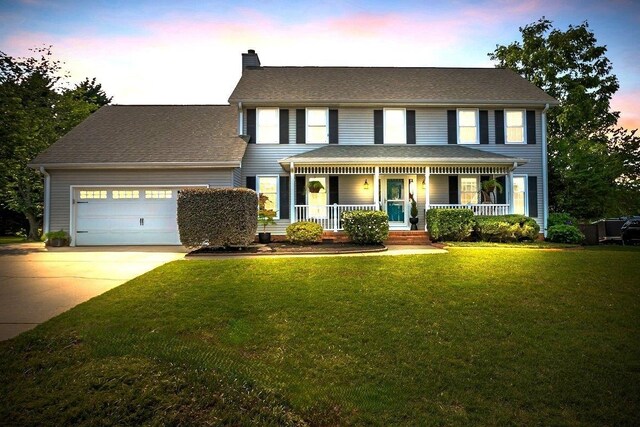 16 Chariot, Simpsonville, SC 29681 - colonial home featuring covered porch, a chimney, a garage, driveway, and a front lawn