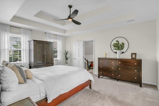 16 Chariot, Simpsonville, SC 29681 - bedroom featuring a raised ceiling, light carpet, baseboards, and a ceiling fan