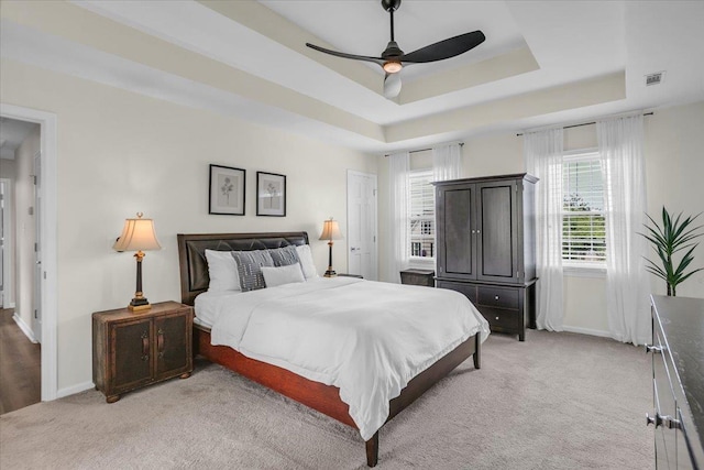 16 Chariot, Simpsonville, SC 29681 - bedroom with light colored carpet, baseboards, a raised ceiling, and a ceiling fan