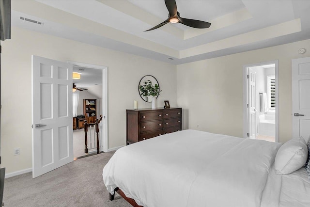 16 Chariot, Simpsonville, SC 29681 - bedroom featuring light colored carpet, a tray ceiling, baseboards, connected bathroom, and multiple windows