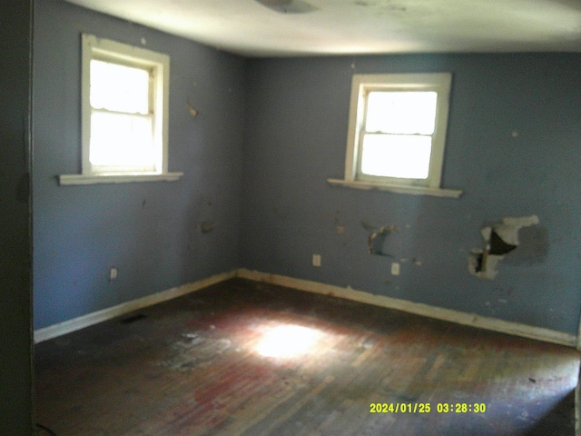 796 Neal, Woodruff, SC 29388 - empty room featuring plenty of natural light, wood finished floors, and baseboards
