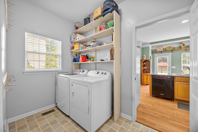 6533 NW Derby, Concord, NC 28027 - laundry area with washing machine and clothes dryer and baseboards