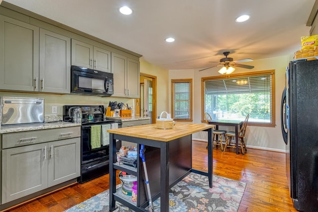 114 Cotswold, Moore, SC 29369 - kitchen with black appliances, gray cabinetry, recessed lighting, butcher block counters, and dark wood finished floors