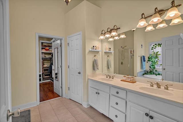2030 Fasana, York, SC 29745 - bathroom with double vanity, a stall shower, tile patterned flooring, baseboards, and a high ceiling