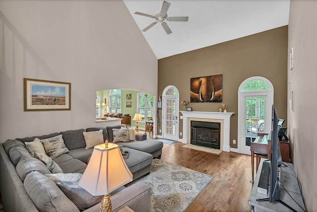 2030 Fasana, York, SC 29745 - living room featuring high vaulted ceiling, ceiling fan, wood finished floors, a fireplace, and arched walkways