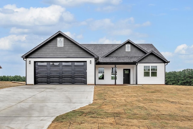541 Bill Lattimore, Chesnee, SC 29323 - view of front of property featuring concrete driveway, an attached garage, a front lawn, and a shingled roof