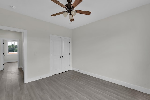541 Bill Lattimore, Chesnee, SC 29323 - unfurnished bedroom with baseboards, wood finished floors, a closet, and ceiling fan