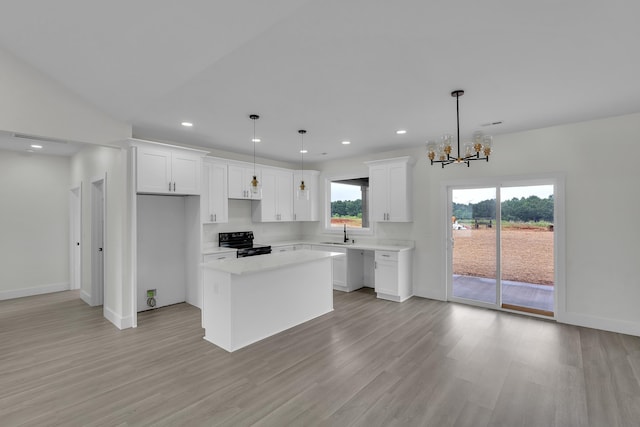 541 Bill Lattimore, Chesnee, SC 29323 - kitchen with black range with electric cooktop, a sink, light wood finished floors, a center island, and baseboards