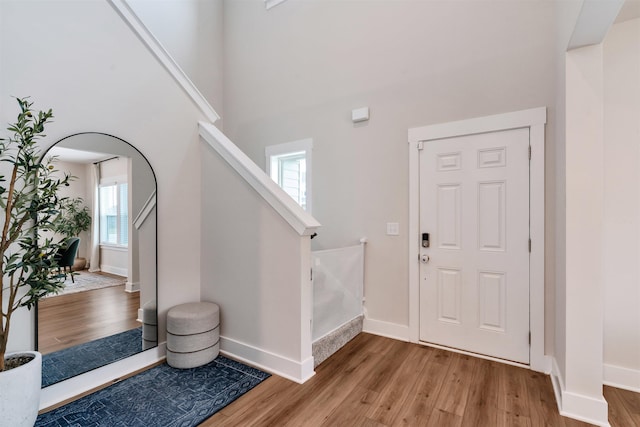 609 Cartmel, Greer, SC 29651 - foyer entrance featuring light wood finished floors, stairway, baseboards, and a towering ceiling